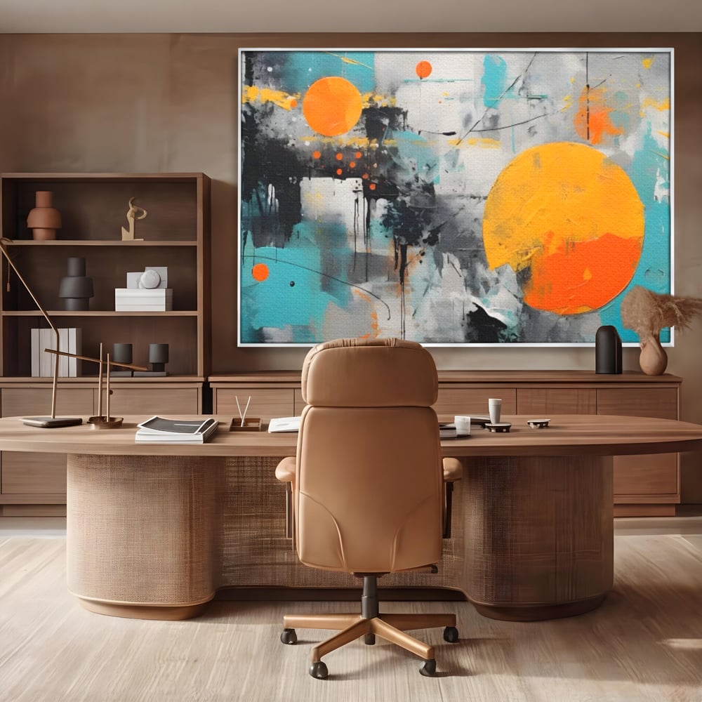Tablou canvas cu tablou abstract cu discuri solare portocalii, in rama de aluminiu argintiu, pe perete intr-un birou